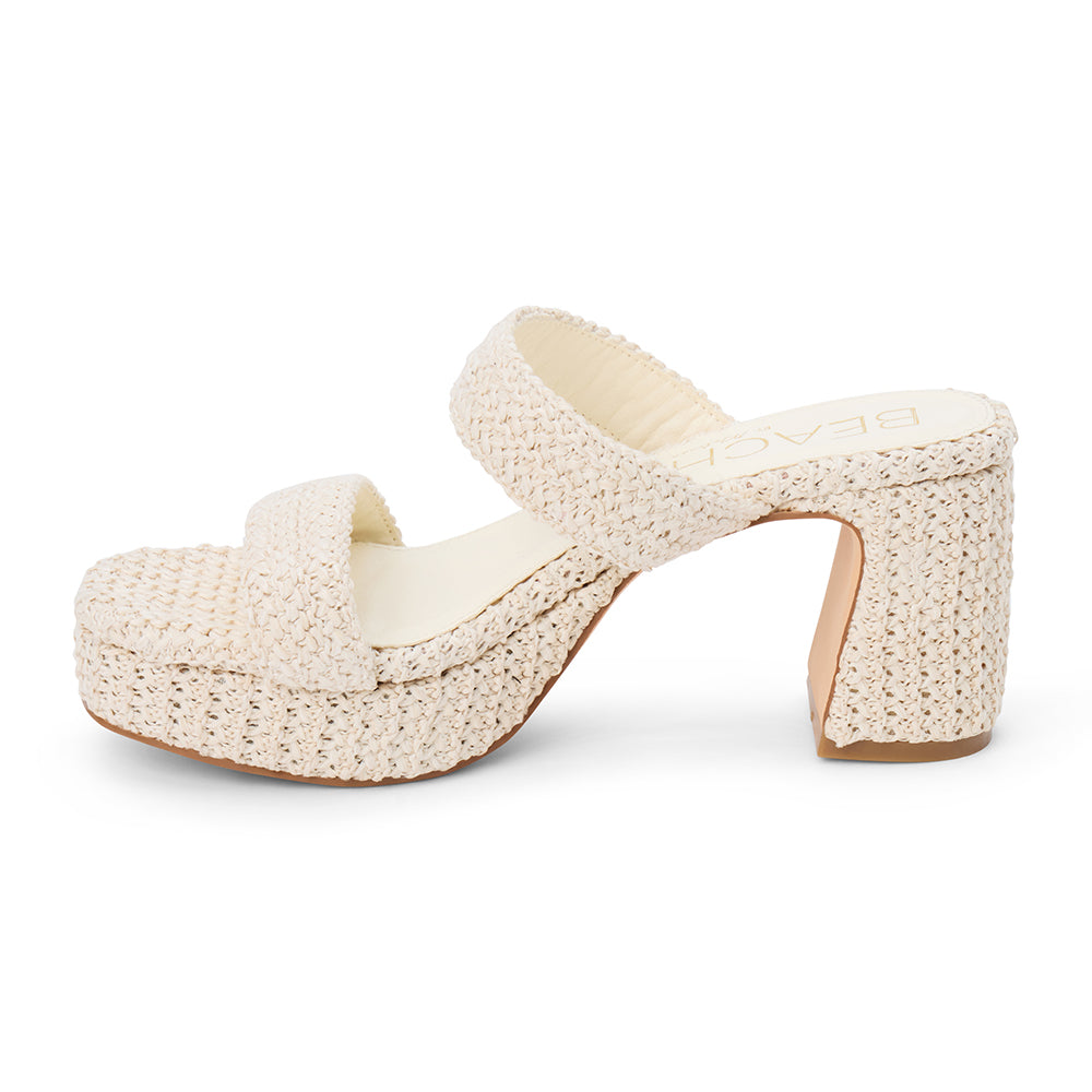 Ivory woven platform sandal with dual straps and a chunky block heel, shown on a white background.
