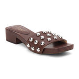 Brown vegan slide sandal with silver stud accents and low block heel, shown on a white background.