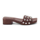 Brown vegan slide sandal with silver stud accents and low block heel, shown on a white background.