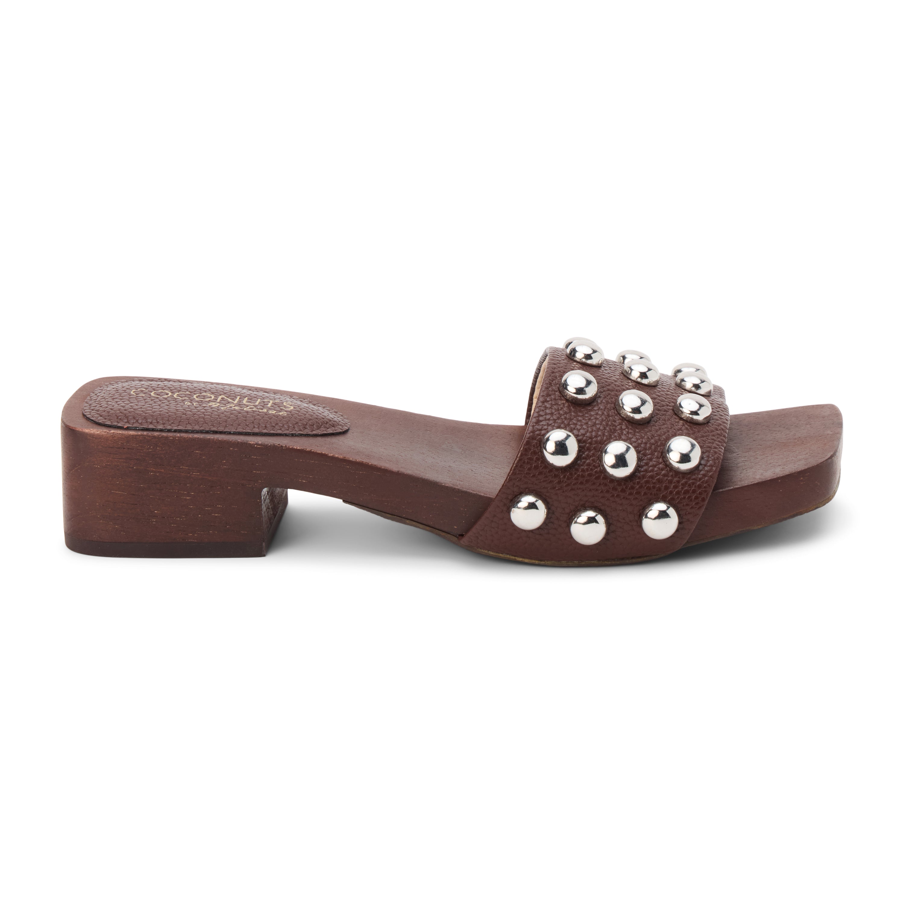 Brown vegan slide sandal with silver stud accents and low block heel, shown on a white background.