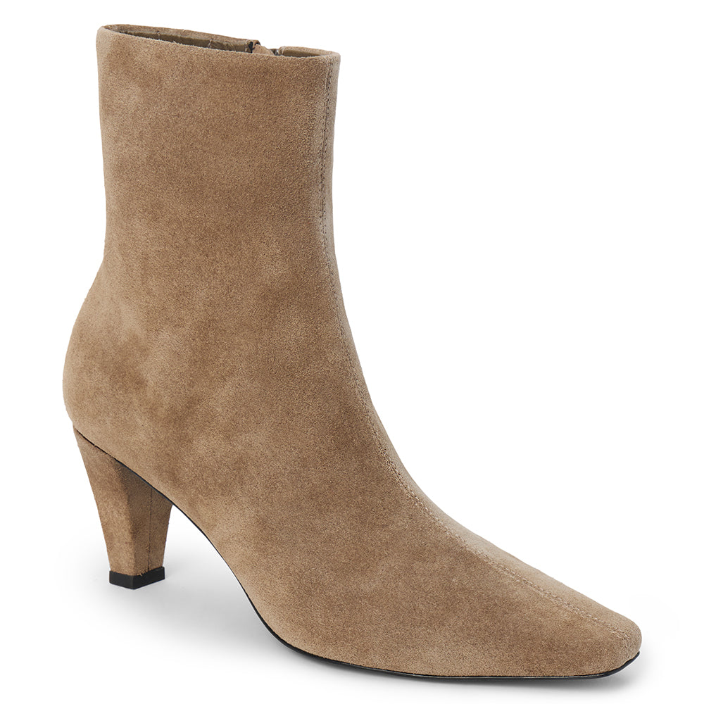 Taupe suede ankle boot with a squared toe, slim tapered heel, and minimalist upper shown on a white background.