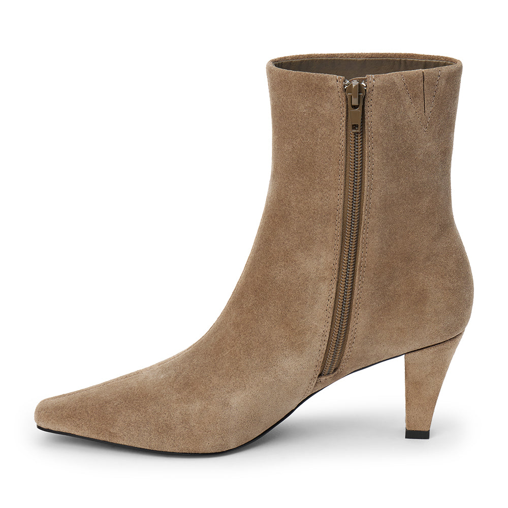 Taupe suede ankle boot with a squared toe, slim tapered heel, and minimalist upper shown on a white background.