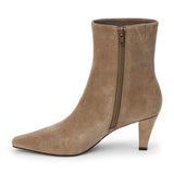 Taupe suede ankle boot with a squared toe, slim tapered heel, and minimalist upper shown on a white background.