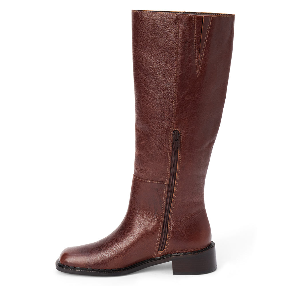 Brown leather knee-high boot with a rounded toe, low block heel, and smooth upper shown on a white background.