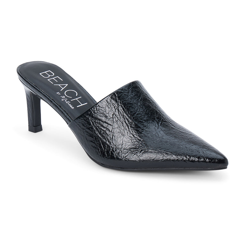 Garret Heeled Mule – Beach by Matisse – Black pointed-toe slip-on mule with textured finish and stiletto heel.