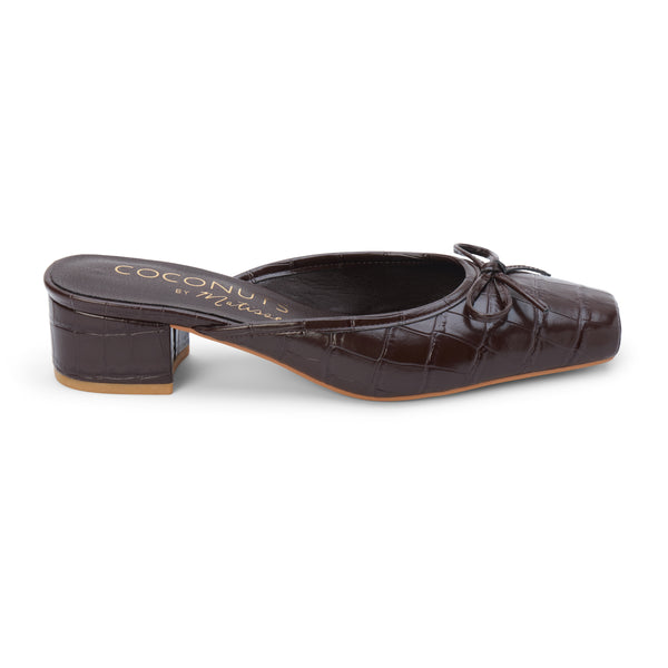 Geneva Heeled Mule – Coconuts by Matisse – Dark brown croc-embossed mule with a square toe, low block heel, and delicate bow detail.