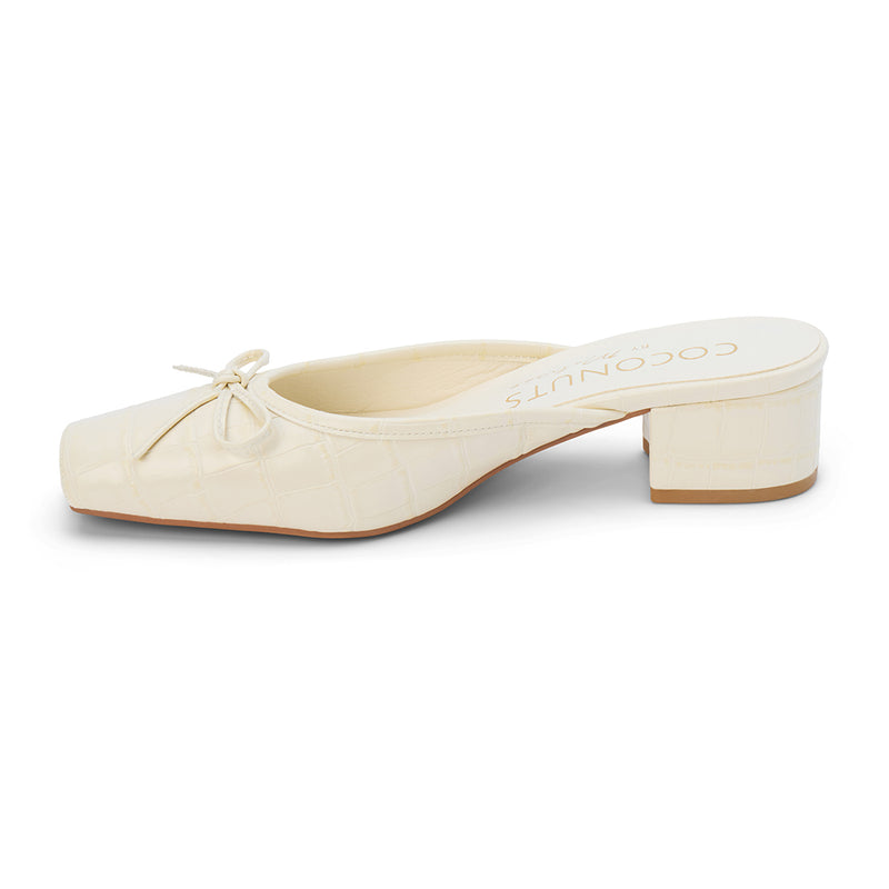 Geneva Heeled Mule – Coconuts by Matisse – Ivory croc-embossed mule with a square toe, low block heel, and delicate bow detail.