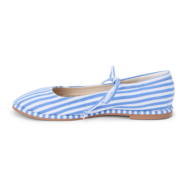 Gerry Ballet Flat – Coconuts By Matisse – Blue and white striped ballet flat with a rounded toe, delicate crossover tie, and classic bow detail. A playful take on nautical style with feminine charm and everyday ease.