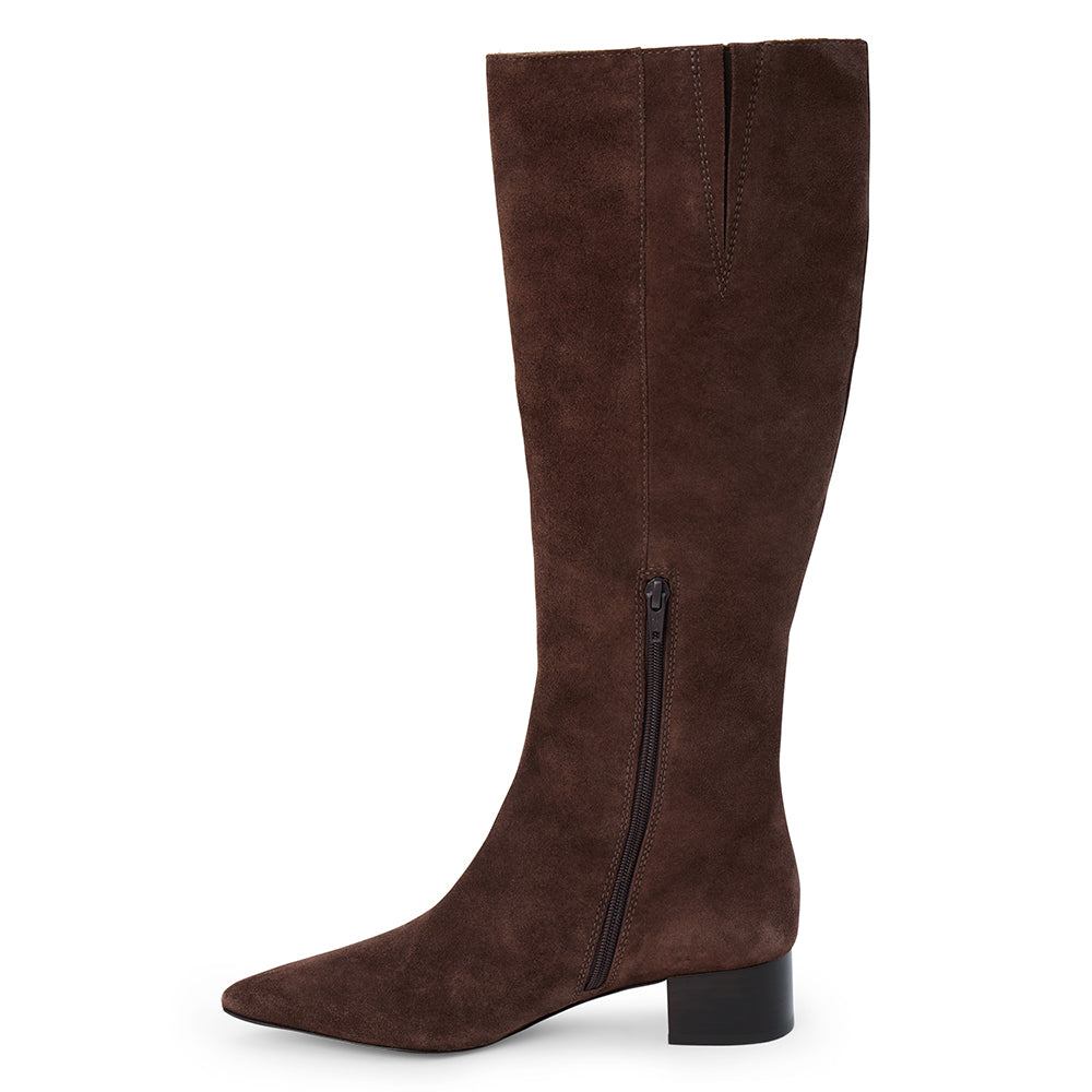 Brown suede knee-high boot with a streamlined tall shaft, pointed toe, and black low block heel shown on a white background.