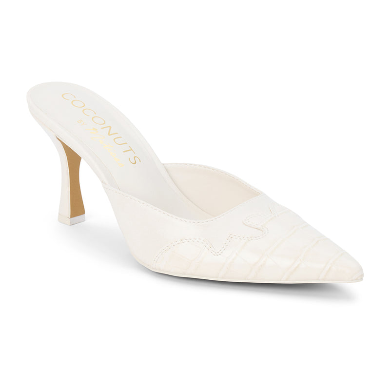 Greer Vegan Heeled Mule – Coconuts by Matisse – White pointed-toe mule with Western-inspired stitching, faux croc embossing, and a sculpted heel.