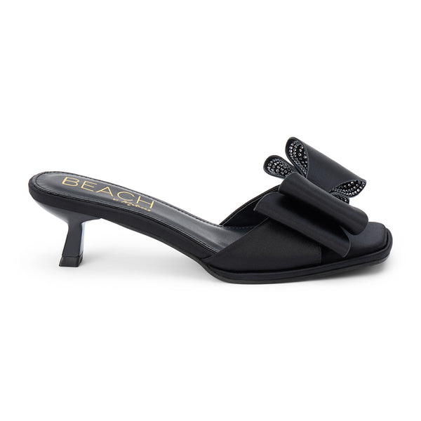 Holland Vegan Heeled Sandal – Beach by Matisse – Black satin slip-on sandal with kitten heel and oversized double bow detail.
