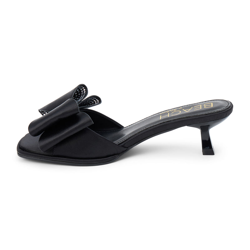 Holland Vegan Heeled Sandal – Beach by Matisse – Black satin slip-on sandal with kitten heel and oversized double bow detail.