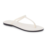 Ivory leather flat thong sandal with slim straps and minimalist design, shown on a white background.
