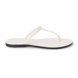 Ivory leather flat thong sandal with slim straps and minimalist design, shown on a white background.