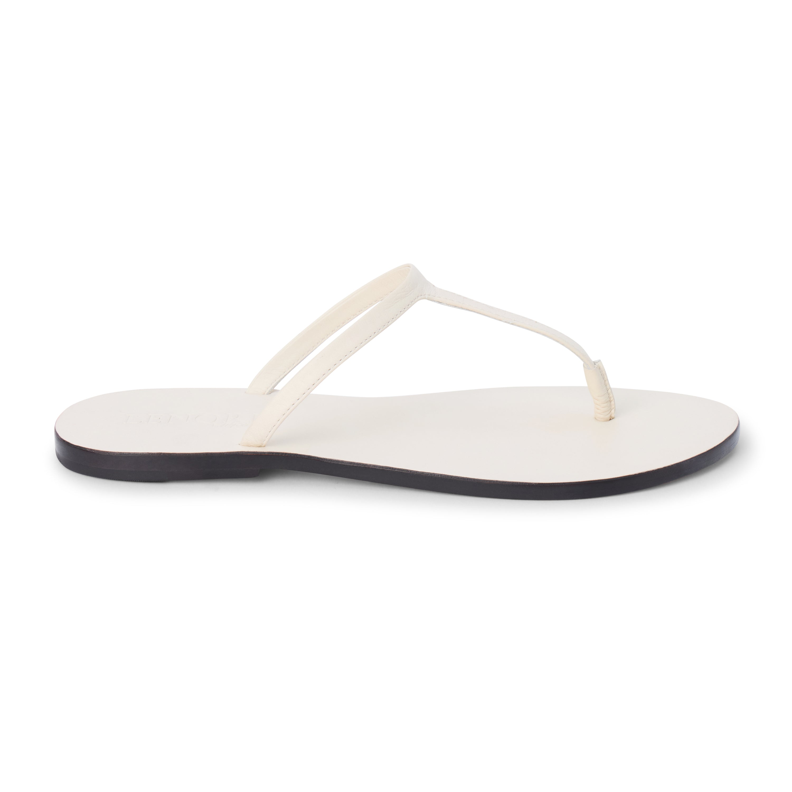 Ivory leather flat thong sandal with slim straps and minimalist design, shown on a white background.
