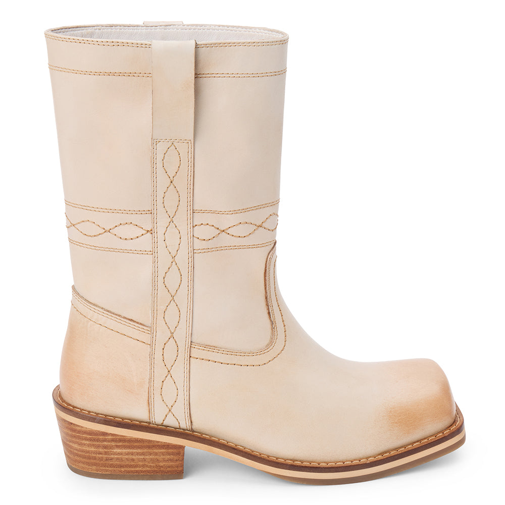 Ivory leather mid-calf boot with western stitching, pull tab, and a low stacked heel, shown on a white background.