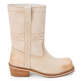 Ivory leather mid-calf boot with western stitching, pull tab, and a low stacked heel, shown on a white background.