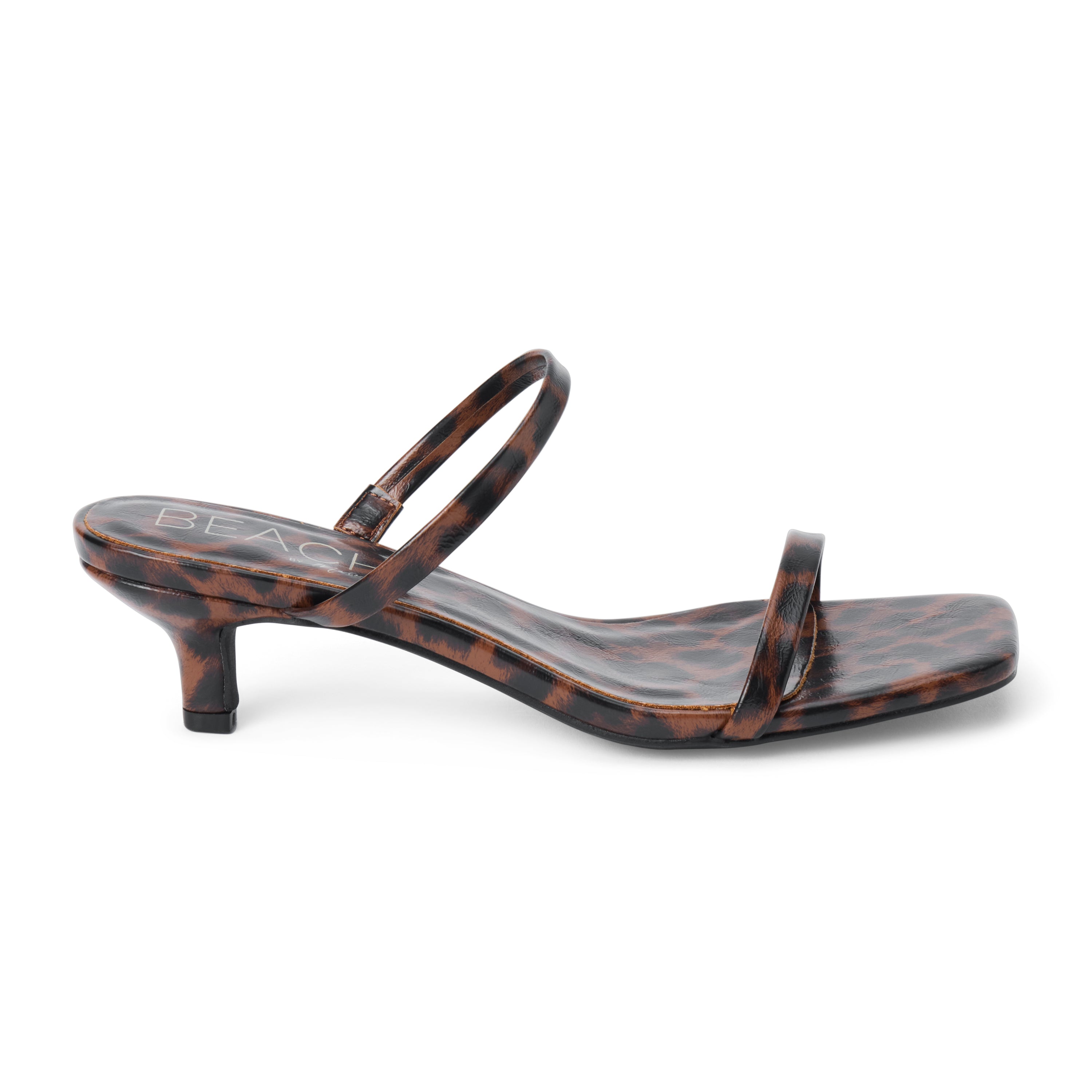 Vegan brown and black leopard-print faux leather sandal with slim straps, a square toe, and low kitten heel shown on a white background.