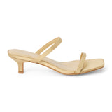 Vegan tan satin sandal with slim toe and instep straps, a square toe, and low kitten heel shown on a white background.