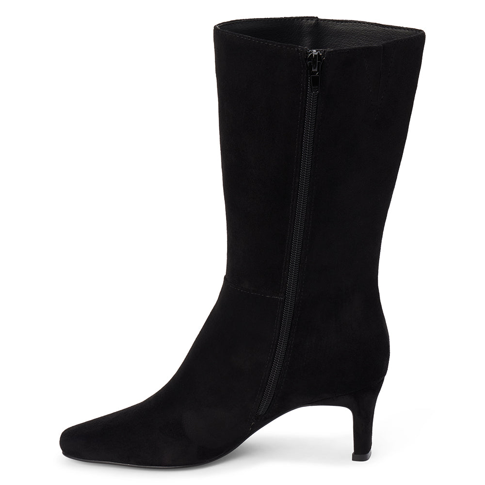 Vegan black faux suede mid-calf boot with a streamlined shaft, square toe, tonal stitching, and slim heel shown on a white background.