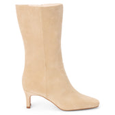 Vegan tan faux suede mid-calf boot with a streamlined shaft, square toe, tonal stitching, and slim heel shown on a white background.