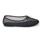 Vegan black sheer mesh ballet flat with black polka dots, a rounded toe, tonal trim, and small bow detail shown on a white background.