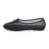Vegan black sheer mesh ballet flat with black polka dots, a rounded toe, tonal trim, and small bow detail shown on a white background.
