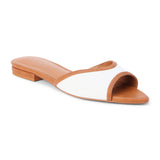 Tan and white vegan slide sandal with wide strap and low heel, shown on a white background.