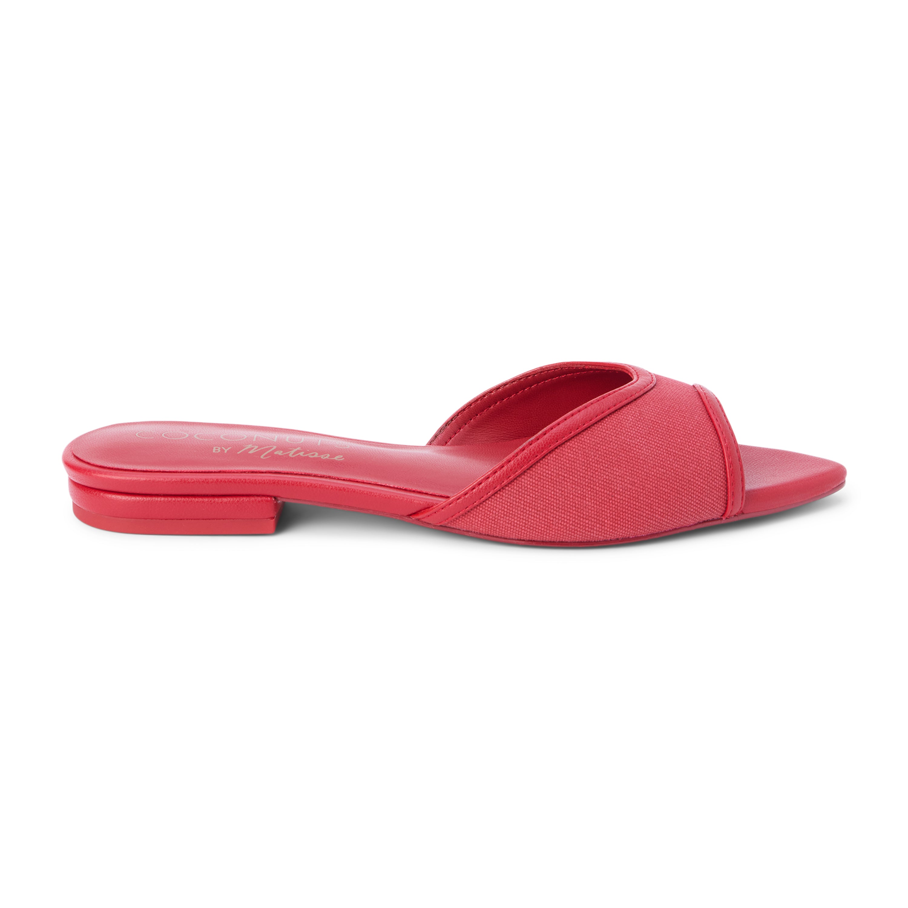 Red vegan slide sandal with wide strap and low heel, shown on a white background.