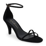 Black suede heeled sandal with a toe loop, slim ankle strap, and tapered heel shown on a white background.