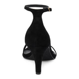 Black suede heeled sandal with a toe loop, slim ankle strap, and tapered heel shown on a white background.