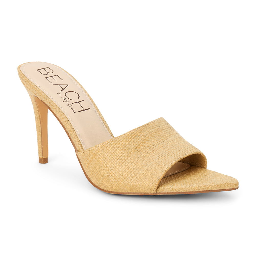 Natural raffia heeled sandal with a pointed toe, woven upper, stiletto heel, and slip-on design, shown on a white background.