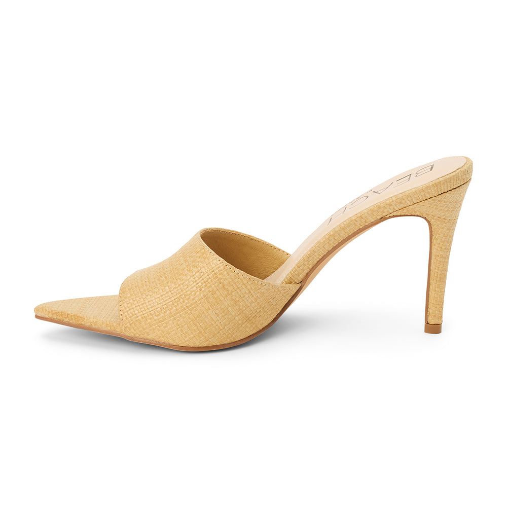 Natural raffia heeled sandal with a pointed toe, woven upper, stiletto heel, and slip-on design, shown on a white background.