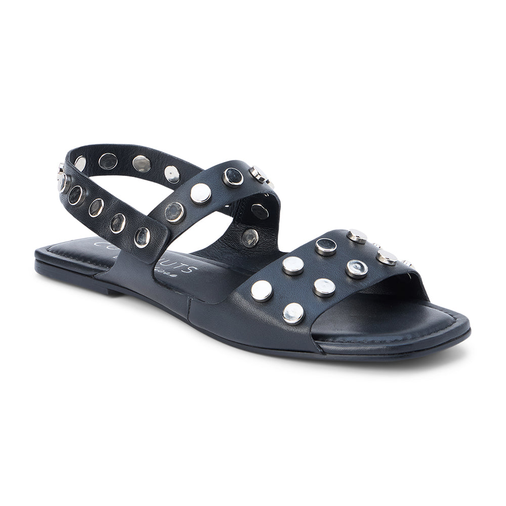 Black leather sandal with silver studs and slingback strap shown on a white background.