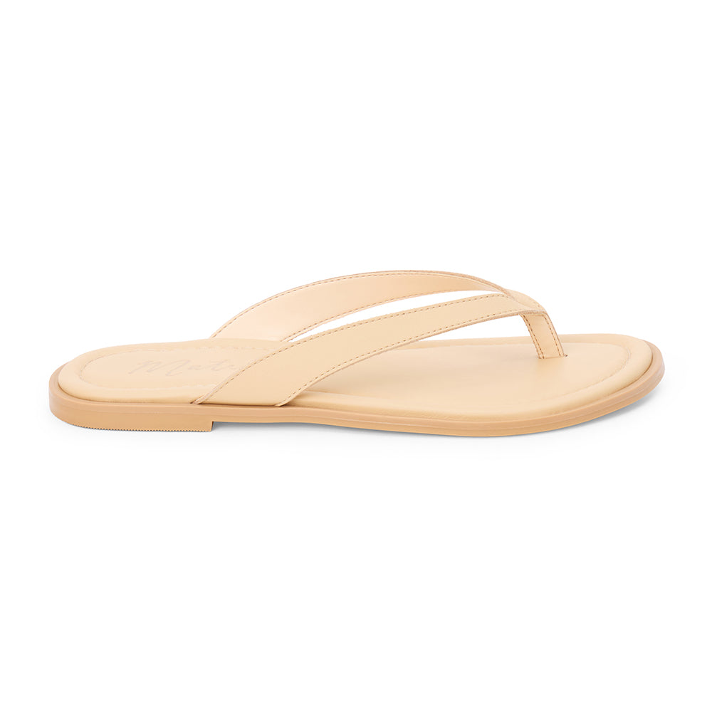 Beige leather flip flop sandal with cushioned footbed and flat sole, shown on a white background.