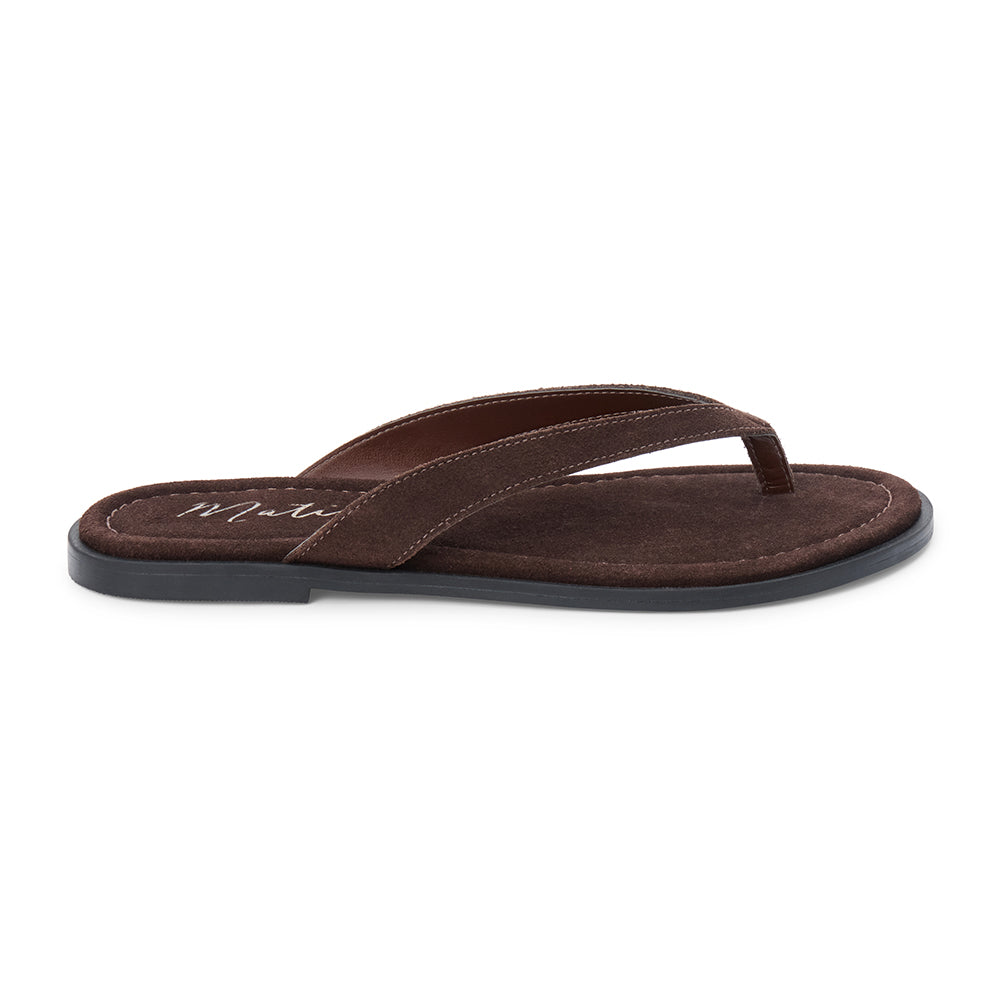 Brown suede flip flop sandal with cushioned footbed and flat sole, shown on a white background.