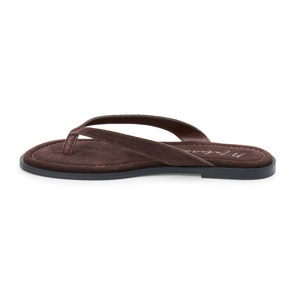 Brown suede flip flop sandal with cushioned footbed and flat sole, shown on a white background.