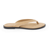 Taupe suede flip flop sandal with cushioned footbed and flat sole, shown on a white background.