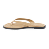 Taupe suede flip flop sandal with cushioned footbed and flat sole, shown on a white background.