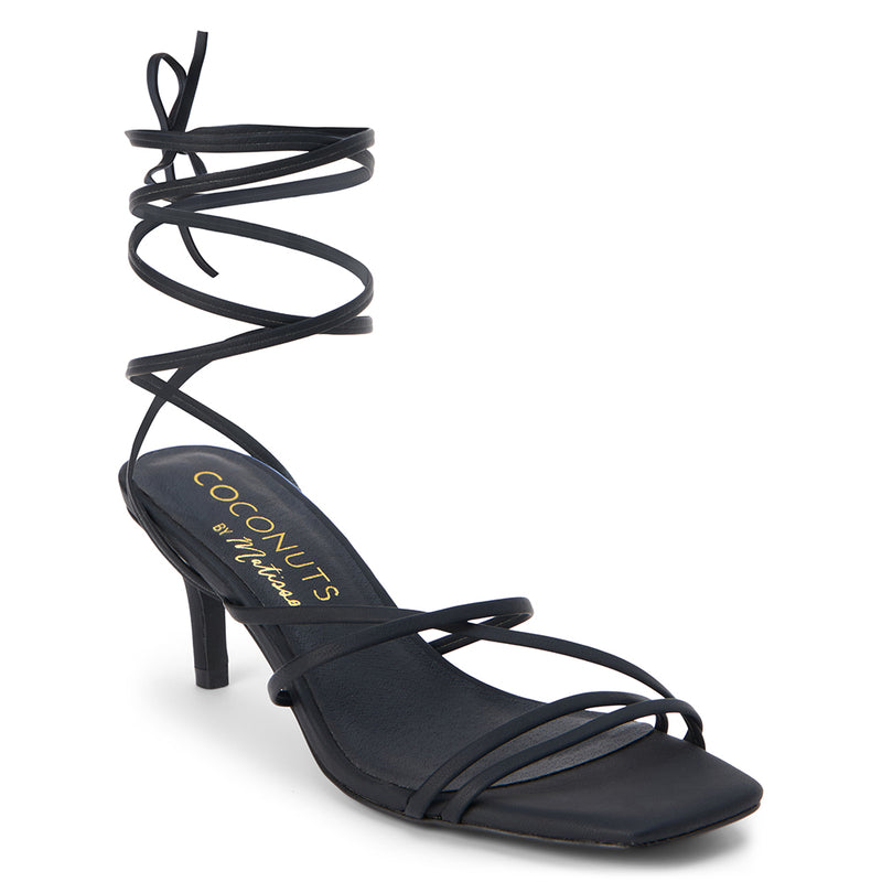 Lilly Heeled Sandal – Coconuts by Matisse – Black strappy sandal featuring a delicate square toe, slender wraparound ankle ties, and a flared kitten heel. An effortlessly sleek silhouette for day-to-night styling.