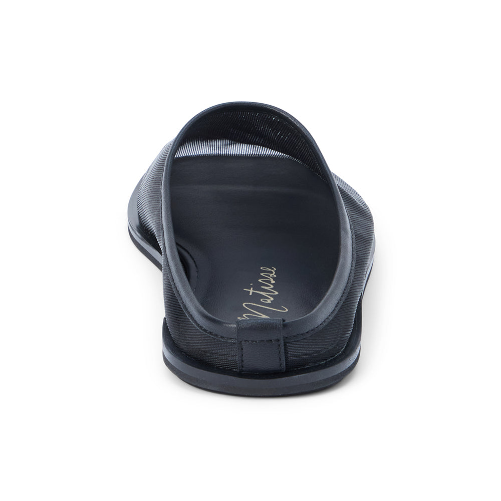 Black mesh slip-on mule with closed toe, open back, low-profile sole, shown in back profile on a white background.