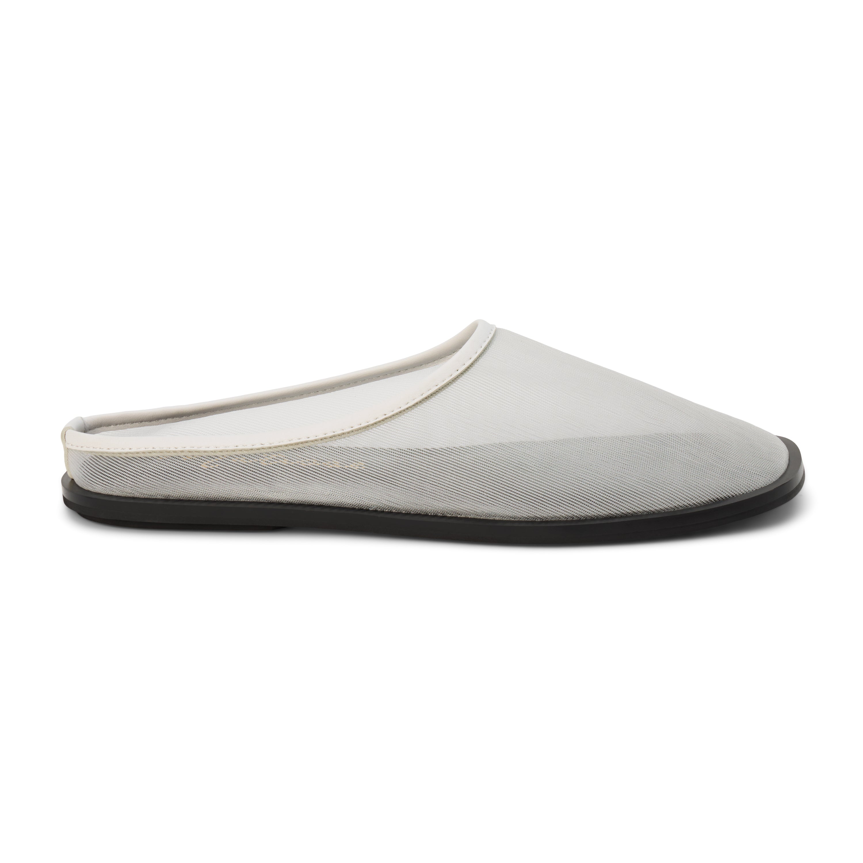 White mesh slip-on mule with closed toe, open back, low-profile sole, shown in side profile on a white background.