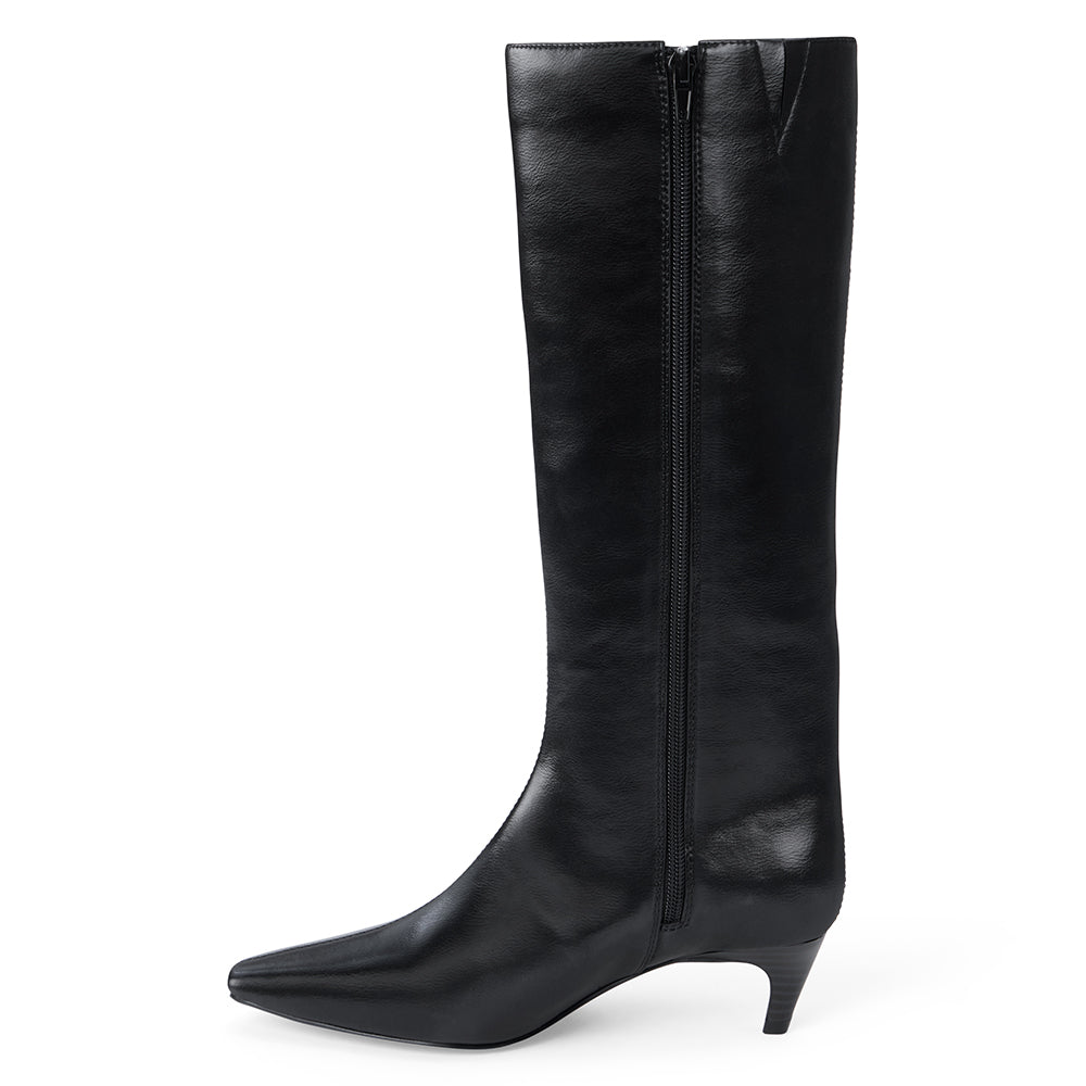 Vegan black faux leather knee-high boot with a tall shaft, pointed toe, and slim black kitten heel shown on a white background.