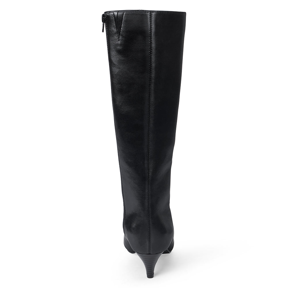 Vegan black faux leather knee-high boot with a tall shaft, pointed toe, and slim black kitten heel shown on a white background.