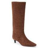 Vegan brown faux suede knee-high boot with a tall shaft, pointed toe, and slim brown kitten heel shown on a white background.