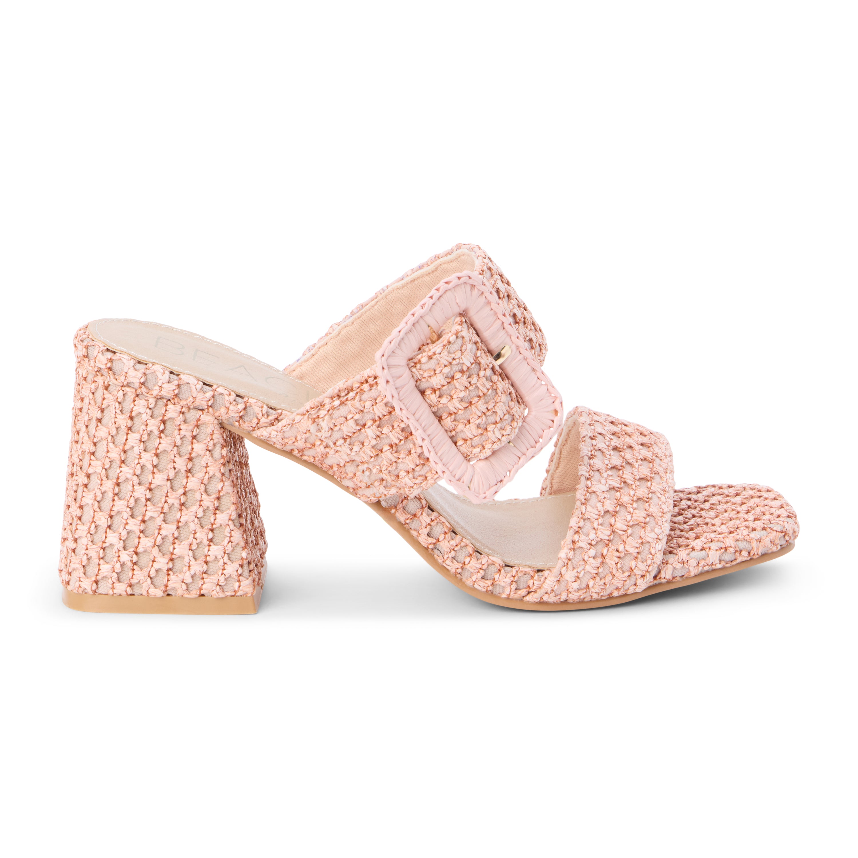 Blush raffia heeled sandal with a wide woven strap, oversized buckle detail, square toe, and block heel, shown on a white background.