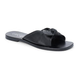 Black leather slide sandal with knotted strap and open toe shown on a white background.