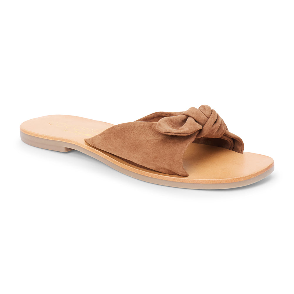 Brown suede slide sandal with knotted strap and open toe shown on a white background.