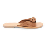 Brown suede slide sandal with knotted strap and open toe shown on a white background.