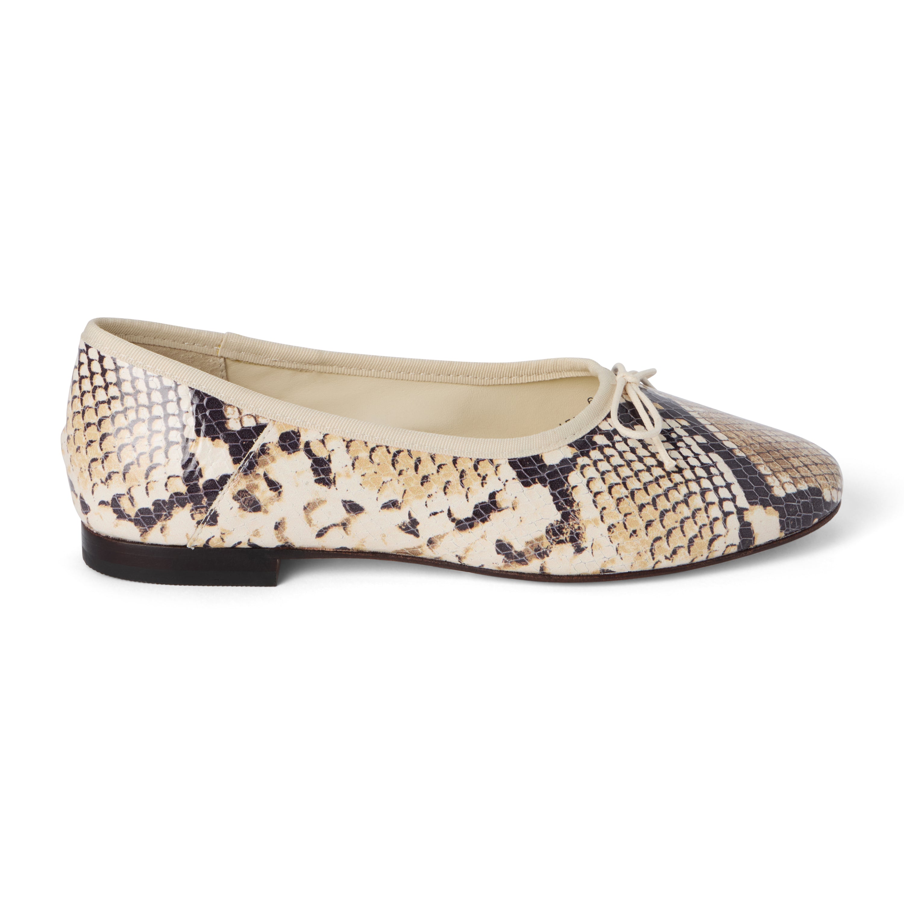 Tan, brown, and black snake-print leather ballet flat with an ivory bow, rounded toe, tonal trim, and low heel shown on a white background.